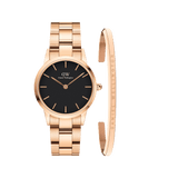 Daniel Wellington Iconic Link Black watch with a black dial and rose gold link strap, paired with a slim rose gold Classic Bracelet engraved with the Daniel Wellington logo, both featuring a minimalist and elegant design.