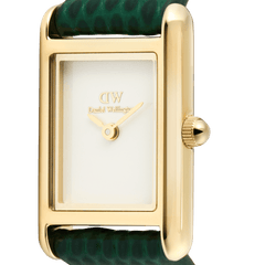 Close-up of the Bound Mini Green Lizard Gold watch showing the polished gold rectangular case, crisp white dial, and the textured green lizard-embossed leather strap.