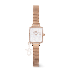 Rose gold ladies watch with a rectangular case, white mother of pearl dial, crystal border, mesh strap, and an interchangeable zodiac charm attached for a personalised touch.