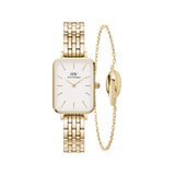 Rectangular gold watch with a white dial and polished 5-link bracelet, paired with a delicate gold chain bracelet featuring a signature ring charm, both crafted from stainless steel with a gold finish.