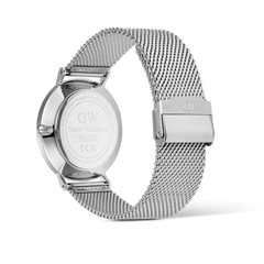 Back view of the Classic Day Display Sterling Champagne watch showing the engraved stainless steel case and adjustable silver mesh strap with a secure clasp.