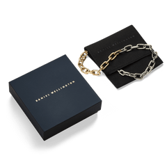 Contrast Link Necklace Two Tone Gold displayed with its elegant Daniel Wellington gift box and pouch, highlighting the striking gold and silver chain links.