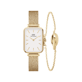 Rectangular gold mesh strap watch with an eggshell white dial paired with a delicate gold chain bracelet featuring a unity ring detail, both designed for a refined and cohesive look.