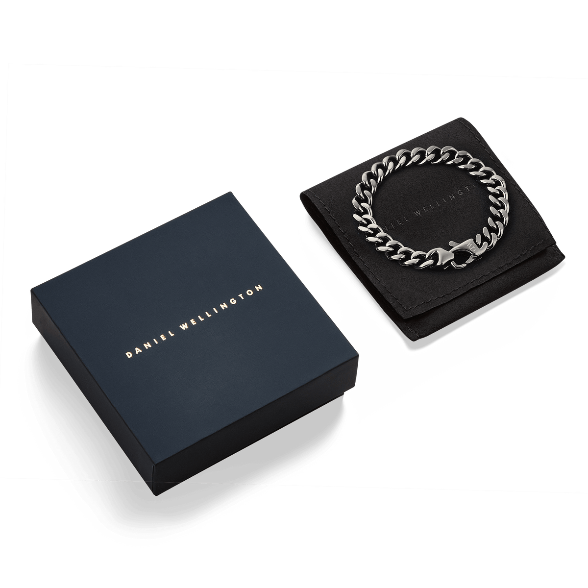 Ellipse Cuban Chain Bracelet Graphite displayed on a black pouch next to a navy Daniel Wellington gift box, showcasing its chunky, polished links and modern graphite finish.