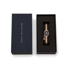 Daniel Wellington Quadro Mini Crystal Zodiac Evergold Set presented in its gift box, featuring a gold mesh strap, crystal-framed rectangular case, black mother of pearl dial, and a crystal zodiac charm.