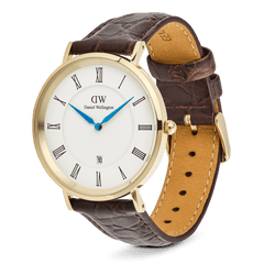 Classic Roman Numerals Date Dark Brown Croc Belly Gold watch with a gold PVD-plated case, white dial, black Roman numerals, blue hands, date window, and a dark brown crocodile-embossed genuine leather strap with pin buckle closure.