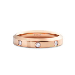 Classic Lumine Ring Rose Gold 4mm with a smooth, polished rose gold band and three round cubic zirconia stones set evenly around the ring, highlighting its minimalist and elegant style.