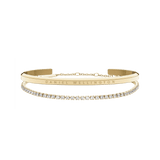 Classic & Tennis Bracelet Gold set featuring a polished gold cuff with engraved branding and a delicate tennis bracelet adorned with clear sparkling stones, displayed together against a plain background.