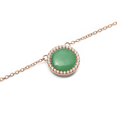 Close-up of the Audrey Necklace Jade Rose Gold pendant, showcasing a polished green jade stone encircled by white cubic zirconia crystals on a rose gold chain.