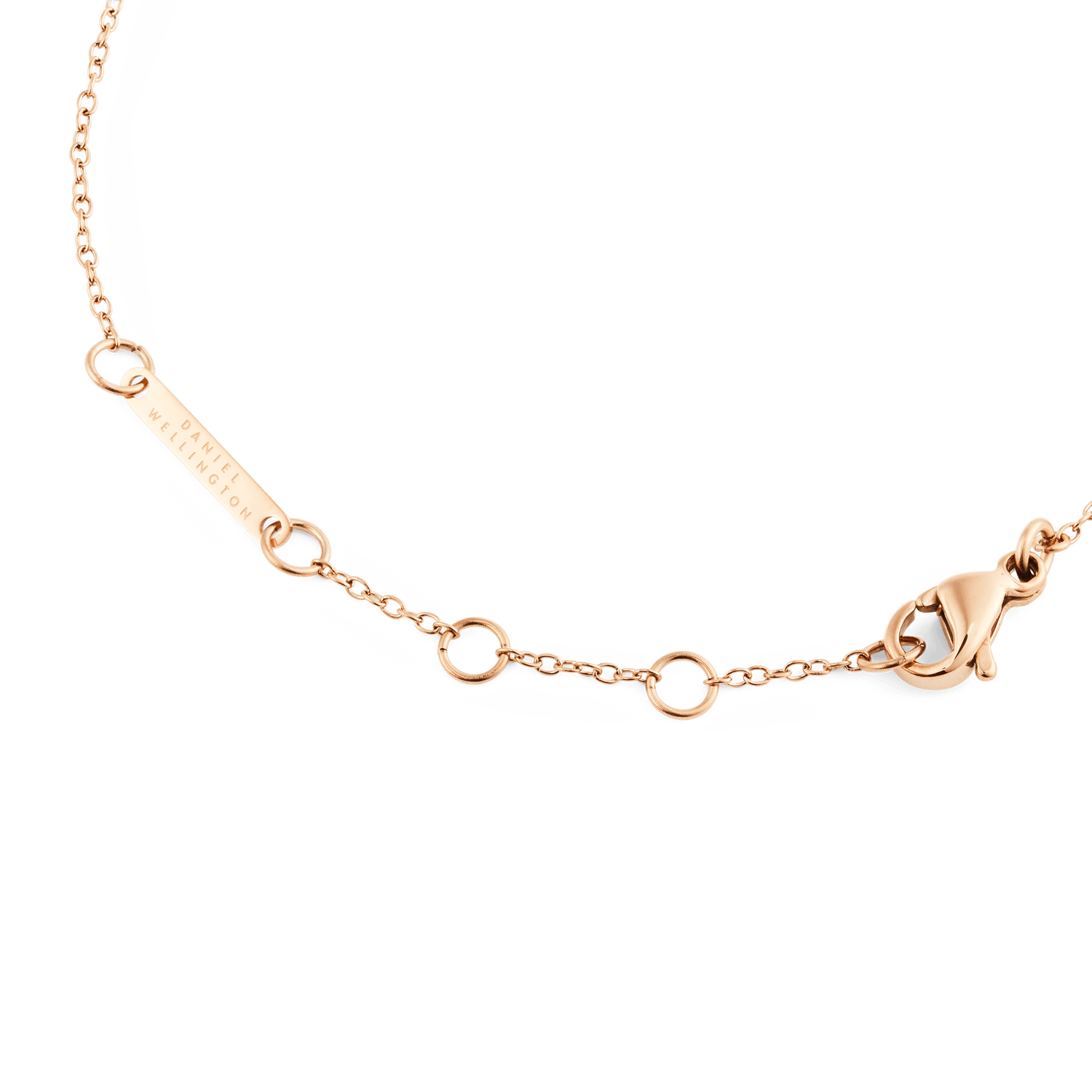 Detail of the Mirelle Solitaire Bracelet Rose Gold showing the adjustable rose gold chain, secure clasp, and Daniel Wellington engraved tag.