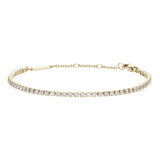 Classic Tennis Bracelet Gold featuring a slim gold chain with individually claw-set cubic zirconia stones and an adjustable clasp, designed for a refined and elegant look.