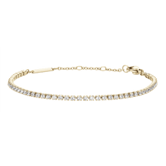 Classic Tennis Bracelet Gold featuring a slim gold chain with individually claw-set cubic zirconia stones and an adjustable clasp, designed for a refined and elegant look.