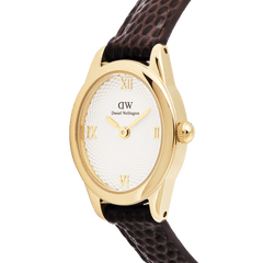 Close-up of the Ophelia Mini Dark Brown Lizard White Guilloché Gold watch, highlighting its polished gold oval case, textured white guilloché dial with gold Roman numerals, and dark brown lizard-embossed leather strap.