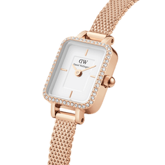 Quadro Mini Lumine Bezel Rose Gold ladies watch featuring a rectangular white dial, crystal-set bezel, and a rose gold mesh strap, shown in close-up to highlight its refined detailing and elegant finish.
