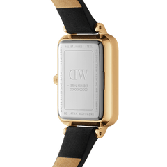 Back view of the Quadro Roman Numerals Sheffield Gold ladies watch showing the stainless steel case, gold plating, and black genuine leather strap, highlighting water resistance and Japanese movement details.