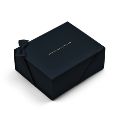 Premium Gift Box Blue featuring a deep blue colour, gold Daniel Wellington logo, and a fabric bow, designed for elegant presentation of gifts such as jewellery or watches.