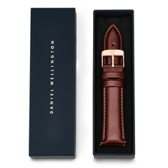 Tapered St Mawes Strap Rose Gold presented in a Daniel Wellington branded box, showcasing the classic brown leather strap with a polished rose gold pin buckle and subtle stitching.