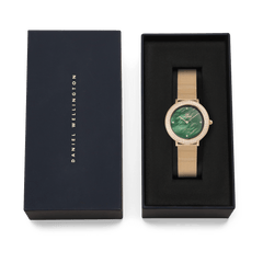 Crystalline Bezel Evergold Green gold ladies watch with a green mother of pearl dial and crystal-set bezel, presented in a Daniel Wellington branded gift box.