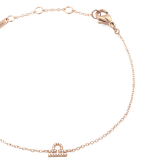Close-up of the Crystal Zodiac Chain Bracelet Rose Gold, highlighting the fine rose gold chain, adjustable sizing rings, and a sparkling crystal Libra zodiac pendant.