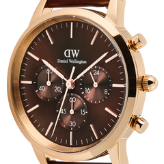 Close-up of the Iconic Chronograph St Mawes Amber RG watch, highlighting its amber sunray dial, three chronograph sub-dials, rose gold case, and minimalist hour markers.