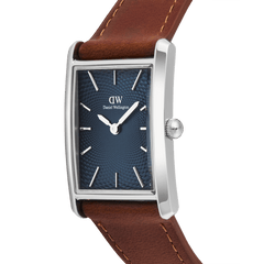 Close-up of the Daniel Wellington Bound Light Brown Arctic Guilloché Silver watch, highlighting its rectangular polished silver case, deep blue guilloché dial, and premium light brown leather strap with detailed stitching.