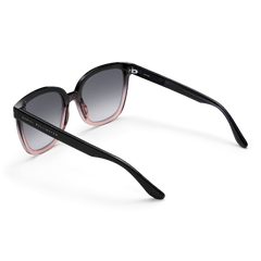 Grande Bio-Acetate Blue Coral Blue sunglasses with a bold square frame, dark blue to coral gradient detailing, black gradient lenses, and Daniel Wellington branding on the arms.