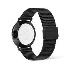 Rear view of the Classic Day Display Onyx Black watch, highlighting the engraved stainless steel case back and the adjustable black mesh strap.