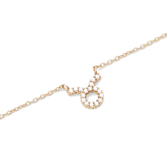 Gold chain necklace with a fixed Taurus zodiac pendant, featuring hand-placed crystals for a sparkling and refined finish.