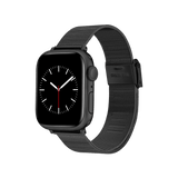 Apple Watch with a matte black mesh stainless steel strap, featuring a slim profile and adjustable clasp for a comfortable, modern fit.