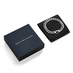 Ellipse Cuban Chain Bracelet Silver displayed on a black pouch next to a Daniel Wellington gift box, showcasing its polished chunky links and elegant presentation for gifting.