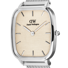 Close-up of the Marlon Sterling Linen watch showing the subtle yellow linen-textured dial, minimalist silver hour markers, and polished stainless steel cushion-shaped case.