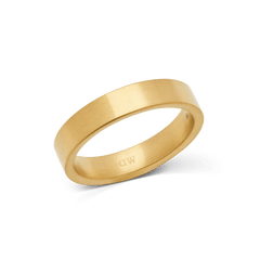A brushed gold ring with a matte finish and minimalist design, featuring a 4.5mm width and a discreet logo on the inside band.