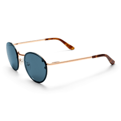 Arch Steel Blue Rose Gold sunglasses with round blue UV400 nylon lenses, rose gold plated stainless steel frame, adjustable silicone nose pads, and tortoiseshell acetate temple tips, presented in a three-quarter view.