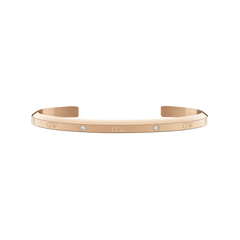 Slim rose gold cuff bracelet featuring six sparkling crystals and a minimalist design, crafted for women and suitable for stacking or pairing with other jewellery.