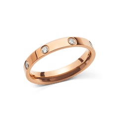 Classic Lumine Ring Rose Gold 4mm featuring a polished rose gold band with cubic zirconia crystals set evenly around the ring, showcasing its minimalist and elegant design.