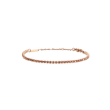 Slim rose gold tennis bracelet featuring apricot-coloured crystals, adjustable chain and lobster clasp, designed for a refined and modern look.