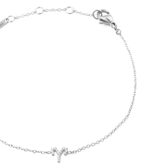 Close-up of the Crystal Zodiac Chain Bracelet Silver featuring a fine adjustable chain and an Aries zodiac charm adorned with sparkling crystals.