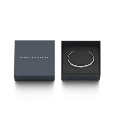 Classic Lumine Bracelet S displayed in a Daniel Wellington gift box, highlighting its slim silver cuff with sparkling crystals as a stylish and elegant gifting option.