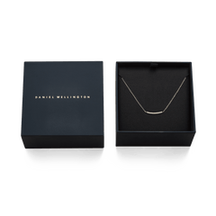 Mirelle Eternity Necklace Gold displayed in an open Daniel Wellington gift box, highlighting its delicate gold chain and sparkling cubic zirconia bar pendant, ideal for gifting or special occasions.