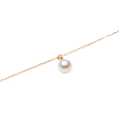 Close-up of the Pearl Necklace Rose Gold, showcasing its single Swarovski glass pearl pendant suspended from a fine rose gold chain with a polished, minimal design.