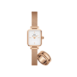 A petite Daniel Wellington ladies watch with a rectangular white dial and rose gold mesh strap, paired with a textured rose gold Elevation Ring, both featuring a polished, elegant finish.