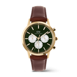 Gold men’s chronograph watch with an emerald green dial, panda-style sub-dials, and a brown stitched leather strap, featuring luminous hands and indexes for clear visibility.
