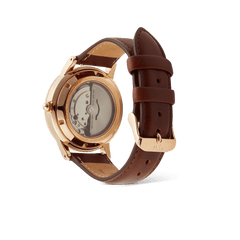 Rear view of the Iconic St Mawes Automatic Rose Gold watch, showing the exhibition case back with visible Japanese automatic movement and brown Italian leather strap with rose gold buckle.