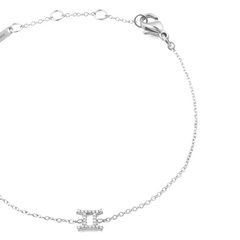 Close-up of the Crystal Zodiac Chain Bracelet Silver, featuring a fine adjustable silver chain and a Gemini zodiac charm set with sparkling crystals.
