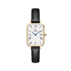 Quadro Roman Numerals Sheffield Gold ladies watch with a rectangular gold case, minimalist white dial featuring Roman numerals, blue steel hands, and a slim black leather strap.
