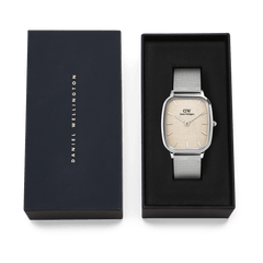 Marlon Sterling Linen men’s watch with a silver mesh strap and yellow linen-textured dial, presented in a black Daniel Wellington gift box.