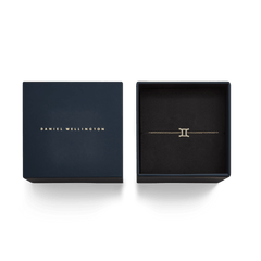Crystal Zodiac Chain Bracelet Gold with a Gemini zodiac charm, presented in a stylish Daniel Wellington gift box.