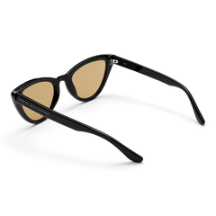 Lynx Bio-Acetate Black/Yellow sunglasses shown from the back angle, highlighting the durable black cat eye frame, yellow nylon lenses, and Daniel Wellington branding on the arm for a stylish designer finish.