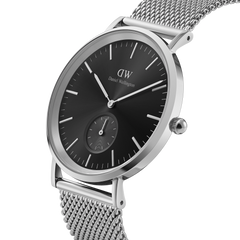 Classic Multi-Eye Sterling Onyx men's watch featuring a black dial, silver mesh strap, minimalist round case, and a seconds subdial, shown in a close-up angle highlighting its polished stainless steel finish.