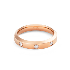 Classic Lumine Ring Rose Gold 4mm with a sleek rose gold finish and three cubic zirconia stones set evenly around the band, offering a refined and modern look.